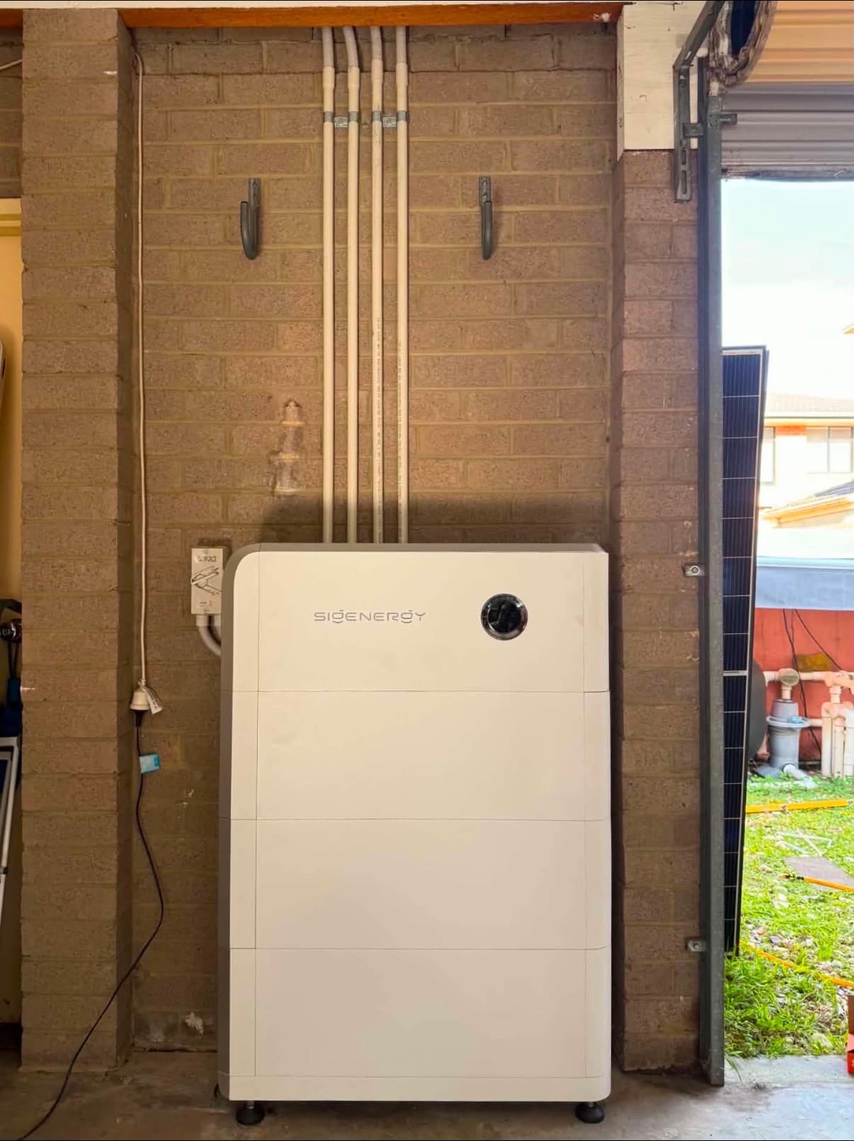 Sigenergy home battery installed in a garage by Ampix Electrical